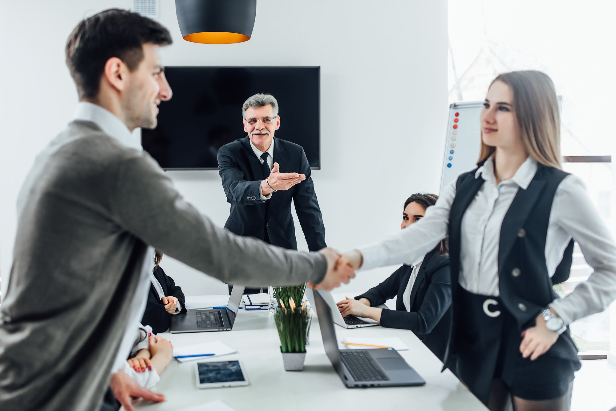 business-people-shaking-hands-finishing-up-meeting-new-manager-office