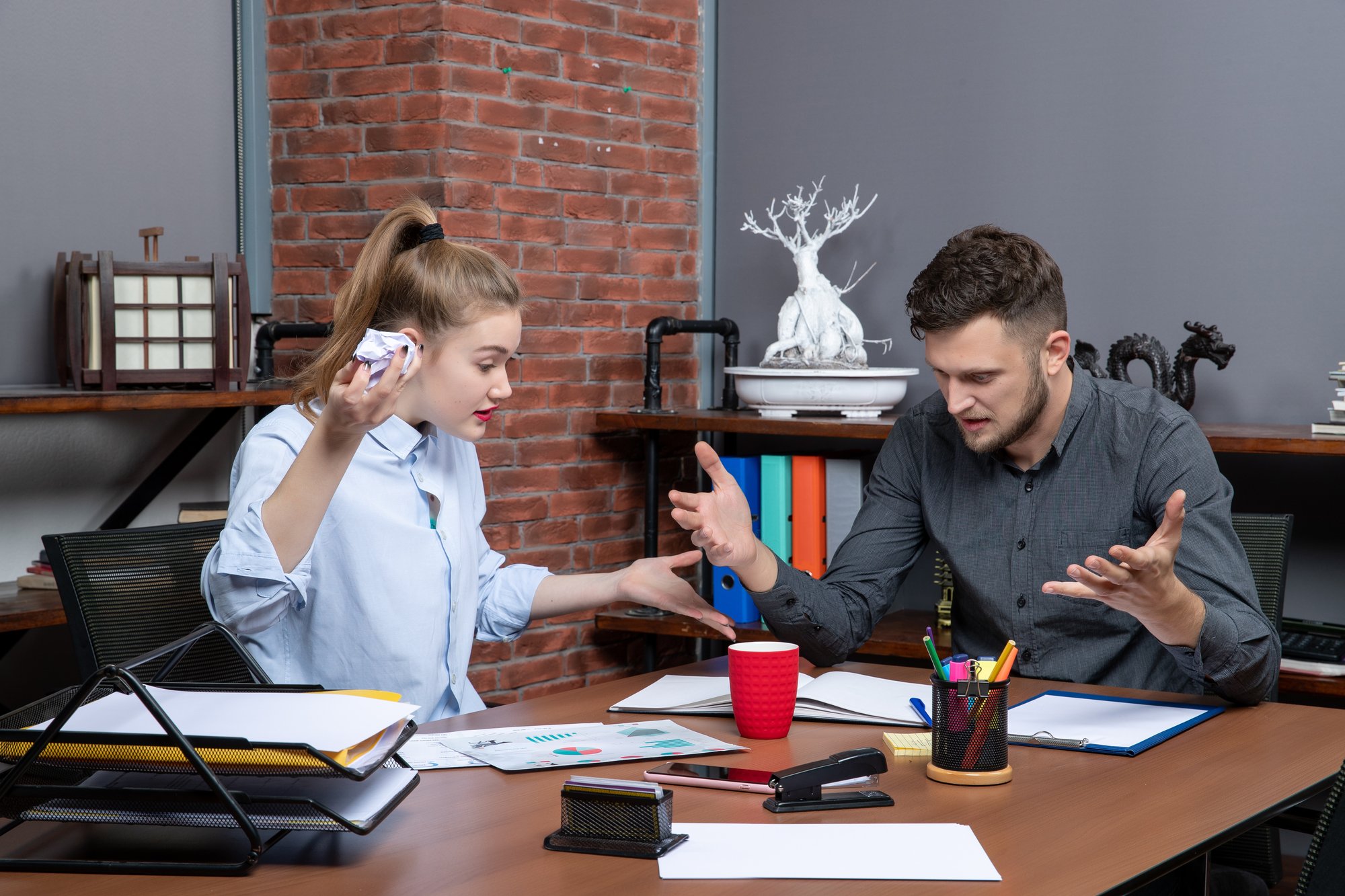 top-view-young-funny-office-team-confused-one-issue-office-enviroment